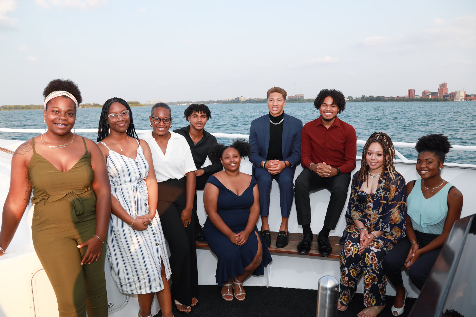 A group of people sitting on top of a boat.